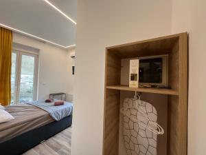Postel nebo postele na pokoji v ubytování F-Residence Thessaloniki Center