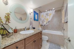 a bathroom with a sink and a tub and a toilet at Eagles Nest Florida in Naples +52 photos