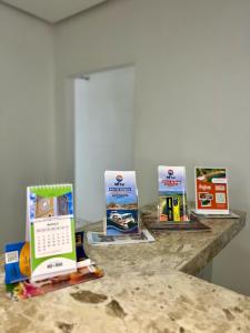 a counter with three boxes of food on it at Pousada Velho Brito in Piranhas
