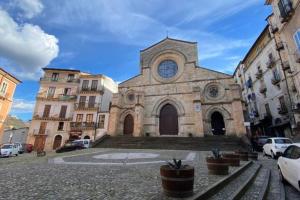 a church with a clock on the front of it at Tesoro di Alarico in Cosenza