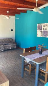 a room with a table and chairs and a bed at casa de un ambiente in Funes