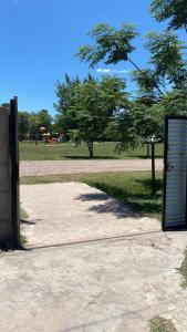 a sign sitting on the side of a park at casa de un ambiente in Funes