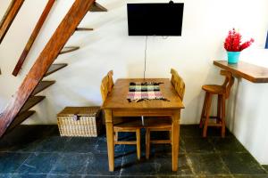 TV a/nebo společenská místnost v ubytování Chale com WiFi, proximo do centro e da praia
