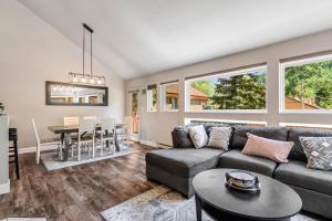 a living room with a couch and a table at Family Vacation Home Hot Tub Pool Free Village Bus in Vail