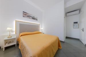 Posteľ alebo postele v izbe v ubytovaní Hotel Marte