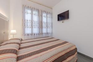 Posteľ alebo postele v izbe v ubytovaní Hotel Marte