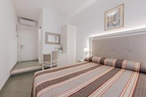 Posteľ alebo postele v izbe v ubytovaní Hotel Marte
