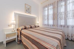 Posteľ alebo postele v izbe v ubytovaní Hotel Marte