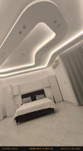 a bed in a room with a ceiling at Paradise Hill in Hurghada