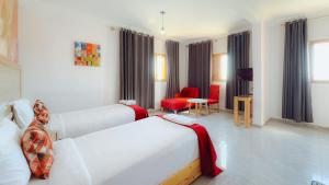 Postel nebo postele na pokoji v ubytování Fyndy Hotel Dakhla