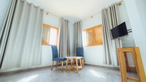 TV a/nebo společenská místnost v ubytování Fyndy Hotel Dakhla