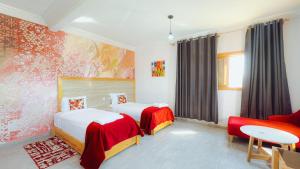 Postel nebo postele na pokoji v ubytování Fyndy Hotel Dakhla