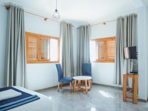 TV a/nebo společenská místnost v ubytování Fyndy Hotel Dakhla