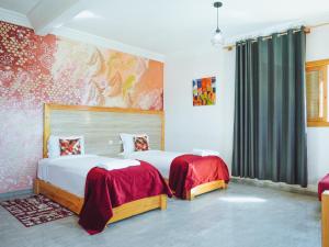 Postel nebo postele na pokoji v ubytování Fyndy Hotel Dakhla + 37 fotografií
