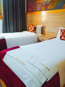 Postel nebo postele na pokoji v ubytování Fyndy Hotel Dakhla