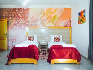Postel nebo postele na pokoji v ubytování Fyndy Hotel Dakhla