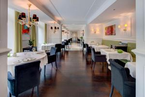 Un restaurante u otro lugar para comer en Anantara Palais Hansen Vienna - newly renovated
