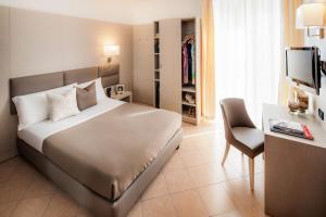 Voodi või voodid majutusasutuse Hotel Vesuvio toas