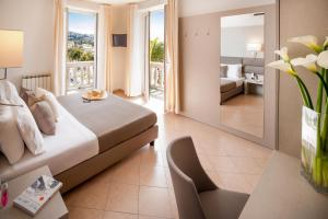 Voodi või voodid majutusasutuse Hotel Vesuvio toas