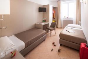 Voodi või voodid majutusasutuse Hotel Vesuvio toas