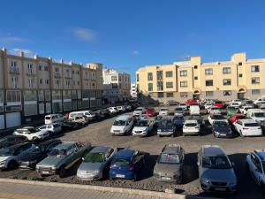 a parking lot filled with lots of parked cars at Margarita House in Arrecife