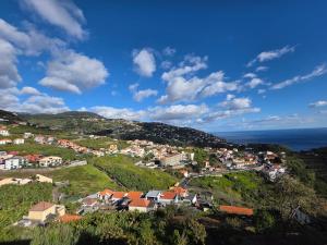 a small town on a hill with the ocean at Silva House in Ribeira Brava