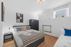 Postel nebo postele na pokoji v ubytování K22 Smart Rooms