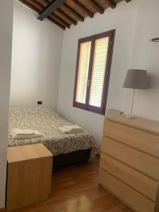 Ένα ή περισσότερα κρεβάτια σε δωμάτιο στο A due passi da Piazza