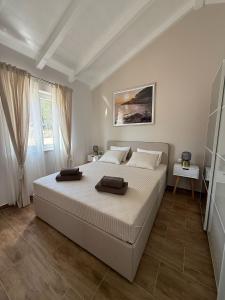 Postel nebo postele na pokoji v ubytování Guest House Lena, Nerezine, Mali Losinj