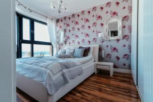 Ένα ή περισσότερα κρεβάτια σε δωμάτιο στο Apartament Martini