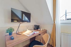 TV a/nebo společenská místnost v ubytování K22 Smart Rooms