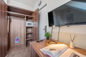 TV a/nebo společenská místnost v ubytování K22 Smart Rooms