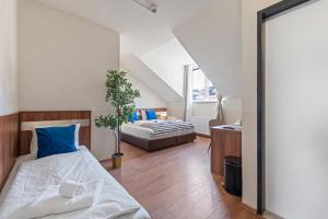Postel nebo postele na pokoji v ubytování K22 Smart Rooms