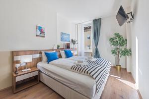 Postel nebo postele na pokoji v ubytování K22 Smart Rooms