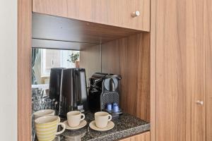 Kuchyň nebo kuchyňský kout v ubytování K22 Smart Rooms