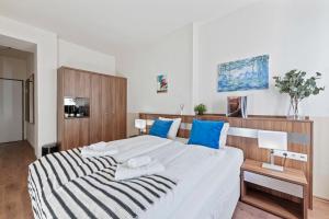 Postel nebo postele na pokoji v ubytování K22 Smart Rooms