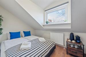 Postel nebo postele na pokoji v ubytování K22 Smart Rooms