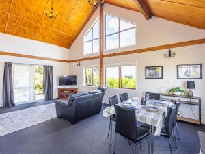 a large living room with a table and chairs at Willstone Chalet - Ohakune Chalet near Turoa in Ohakune