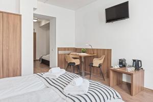 Postel nebo postele na pokoji v ubytování K22 Smart Rooms