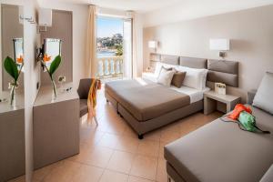 Postel nebo postele na pokoji v ubytování Hotel Vesuvio + 37 fotografií