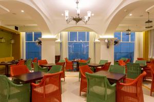 A restaurant or other place to eat at Fragrant Nature Munnar - A Five Star Classified Hotel