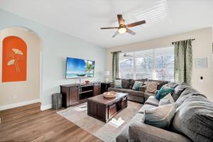 a living room with a couch and a table at Getaway Cove Villa in Orlando