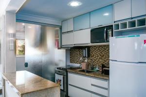 Køkken eller tekøkken på Casa cores, 2 quartos, piscina