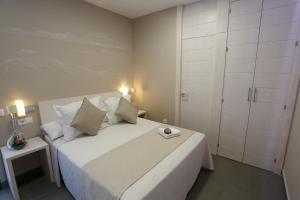 Postel nebo postele na pokoji v ubytování La Pasajera Hostal Boutique