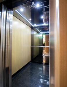 a hallway with a elevator in a building at La Onda Hotel Durres in Durrës