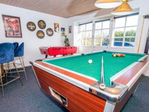 a billiard room with a pool table at Luxury Lodge with Limfjord View - By Traum Ferienwohnungen in Spottrup