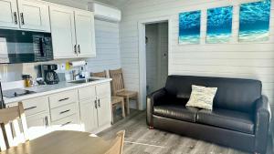 A kitchen or kitchenette at 1 Block to Beach -Brand New Modern Tiny Home
