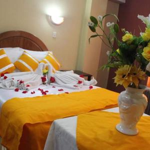 Giường trong phòng chung tại Julio Cesar HOTELES