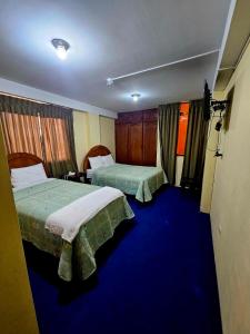 Giường trong phòng chung tại Julio Cesar HOTELES