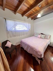 Postel nebo postele na pokoji v ubytování La Casa Ambateña